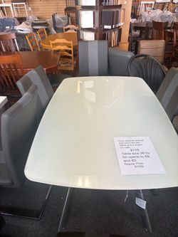 White glass table with 4 chairs
