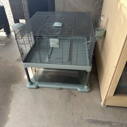 Small Pet Habitat With Water Spout And Feeder On Side 