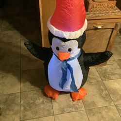 Huntington Home Holiday 4 Foot inflatable Penguin brand new in the box comes with stakes and rope.  This is for indoor or outdoor use Efficient LED li