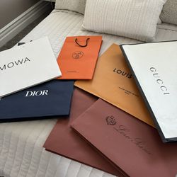Gucci, Loro Piana, Dior, Louis Vuitton, Rimowa shopping bags