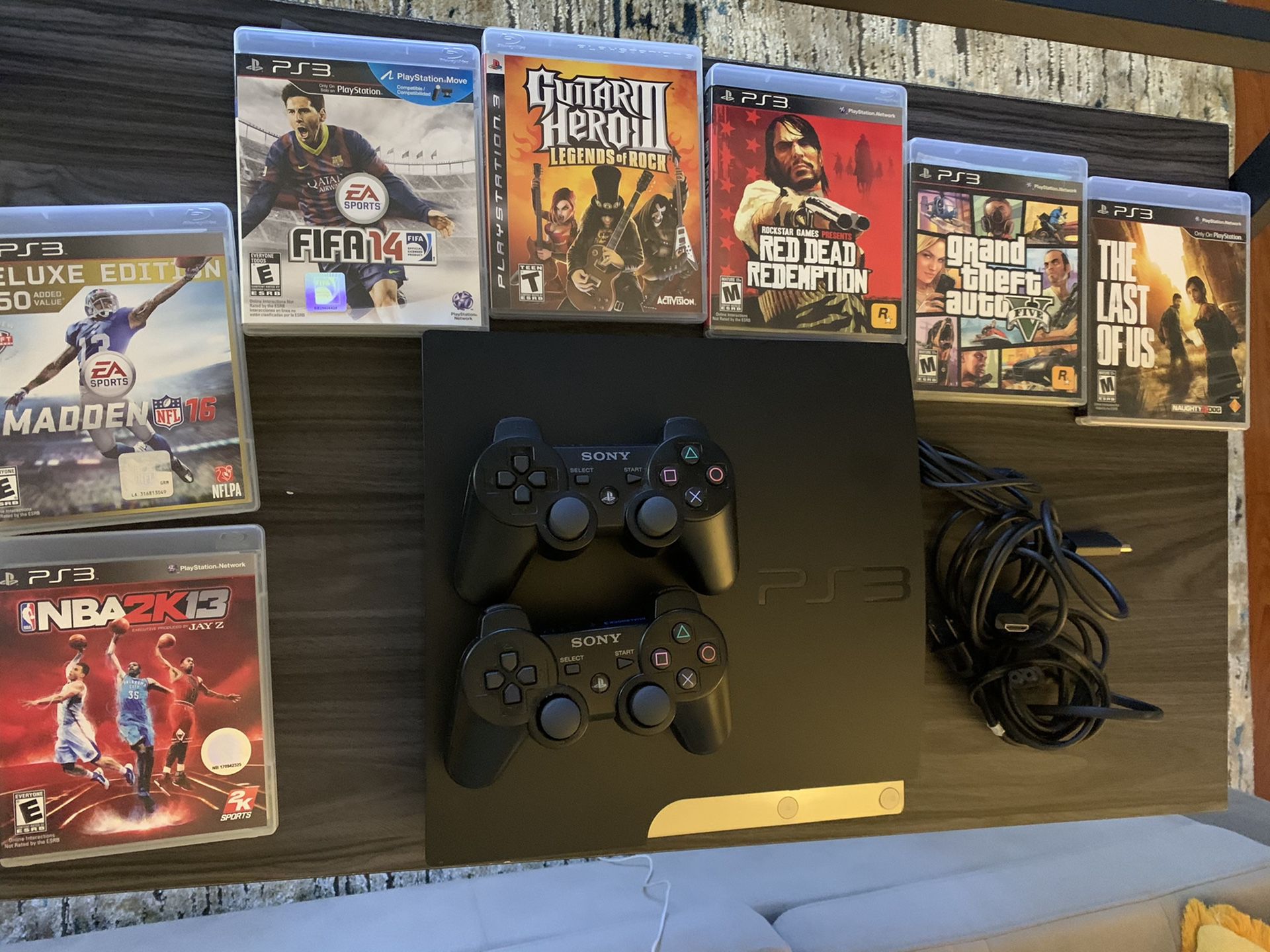 PS3 with 2 Wireless controllers and Games