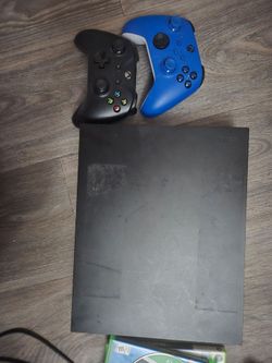 Xbox one x with 3 games and 3 controllers