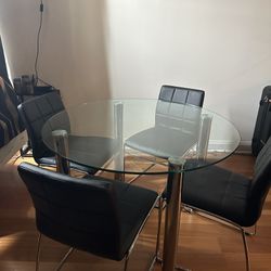 Tempered Glass round Dining room Table with 4 black Faux leather chairs