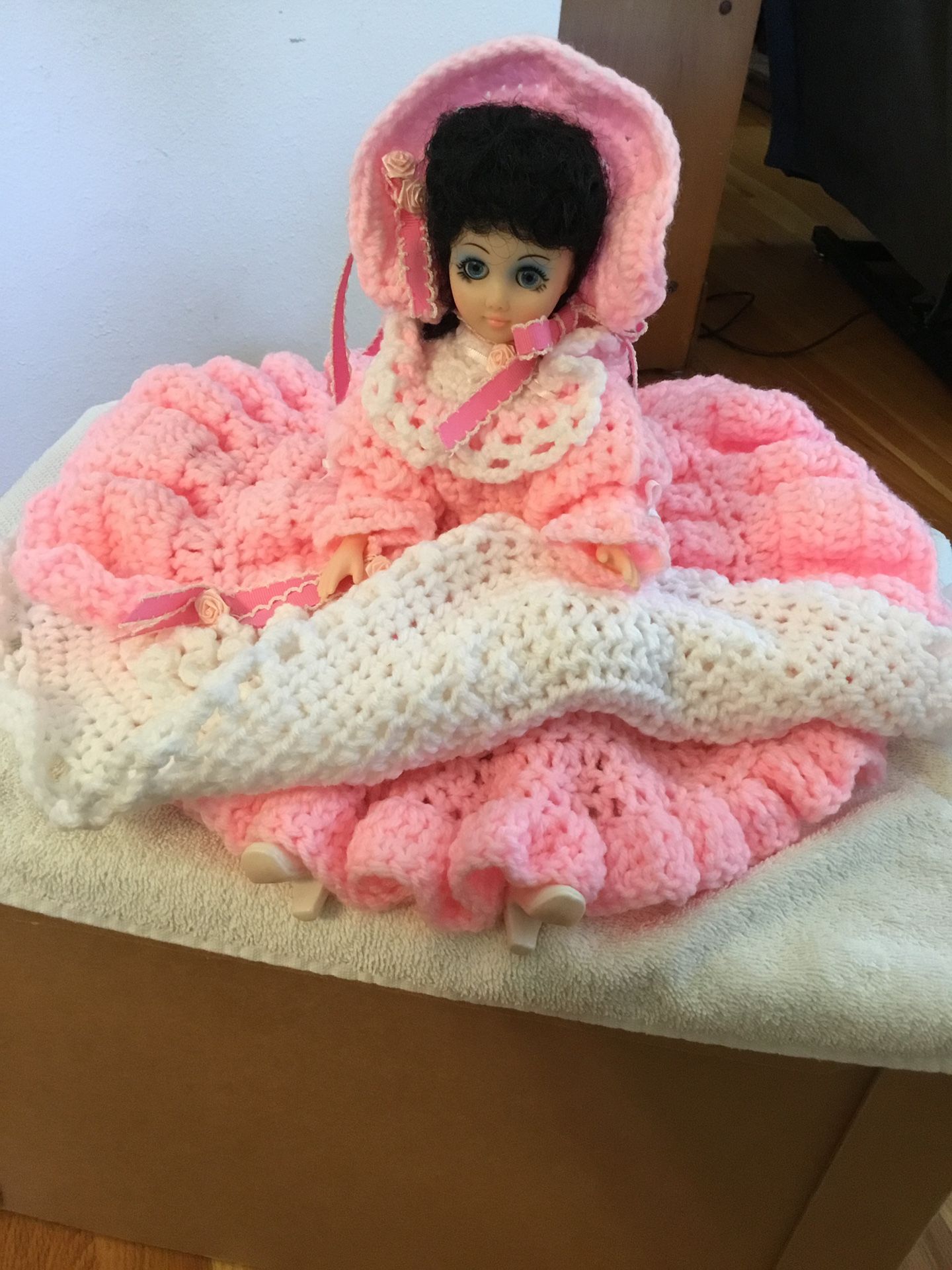Vintage doll with flowing pink crocheted dress and bonnet