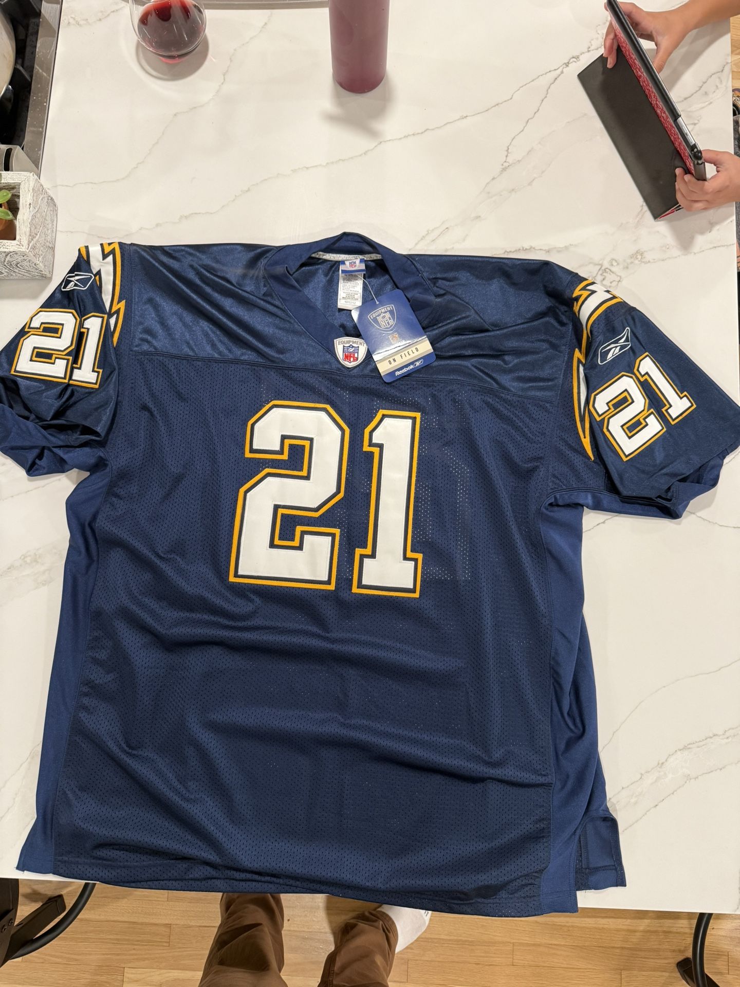 Brand new LaDainian Tomlinson #21 San Diego Chargers jersey. Official Reebok NFL Equipment “On Field” version, size 52 (fits like XL/XXL). Still has t