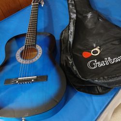 ZENY BEGINNERS GUITAR WITH EXTRA STRINGS AN PIC 