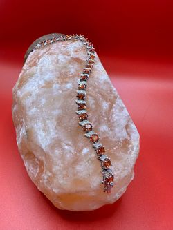 Sterling Silver 925 Tennis Bracelet Features Oval Orange-brown Gemstone it weighs 15 grams