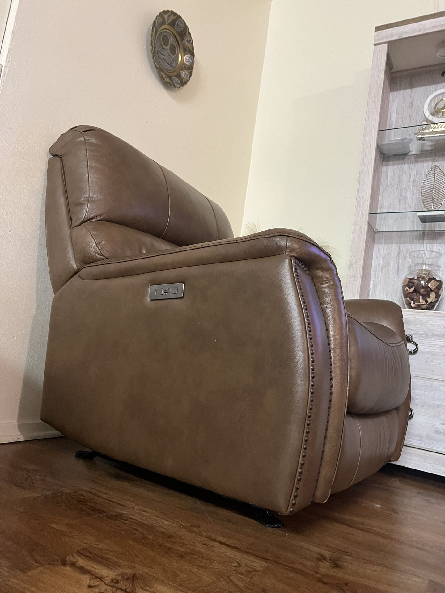 brown single reclining and rocking chair