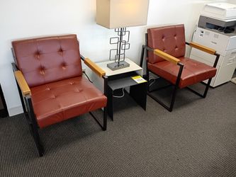 Two Metal Frame Leather Cushion Chairs