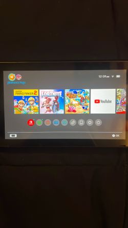 nintendo switch red and blue switches with games downloaded