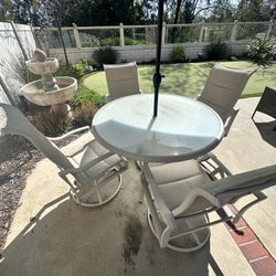 Patio Table + 4 Swivel Chairs – $150