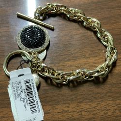 Gold tone bracelet with for charms