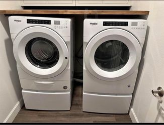 New washer and dryer with pedestals