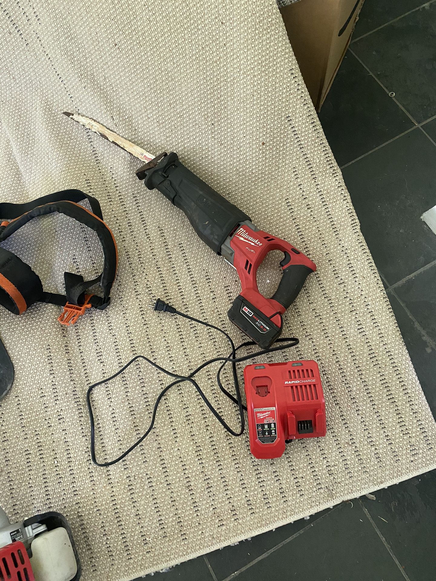 Sawzall Battery, Charger And Blades 