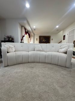 Beige Curved Sectional Sofa with Tufted Back