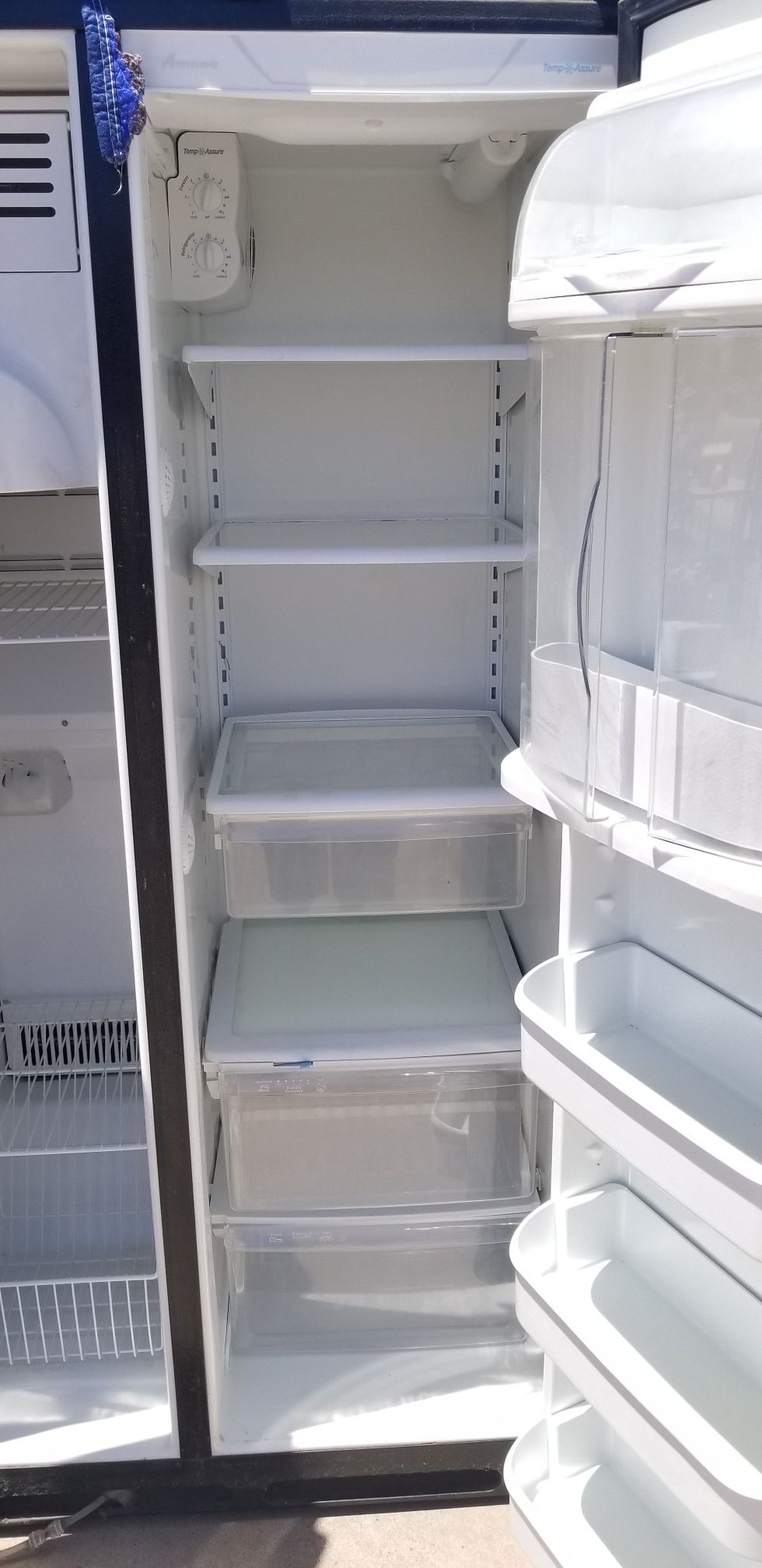 Black Amana fridge with Ice machine and filtered water dispenser for