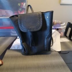 Black backpack purse.