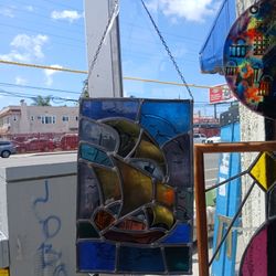 stained glass panel depicting a sailboat Damage 