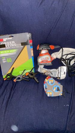 Corded power tool sander with  paper mask and safety glasses