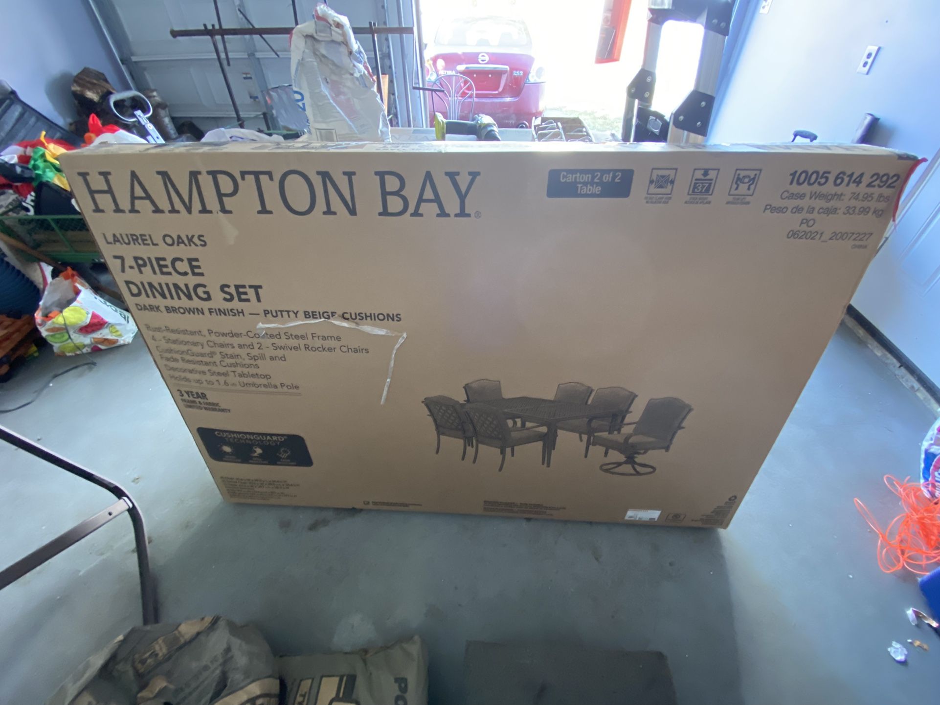 Hampton Bay Laurel Oaks 7-Piece Black Steel Outdoor Patio Dining Set with CushionGuard Putty Tan Cushions