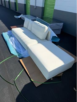 124“ sofa new from the box!! Ottoman is removable