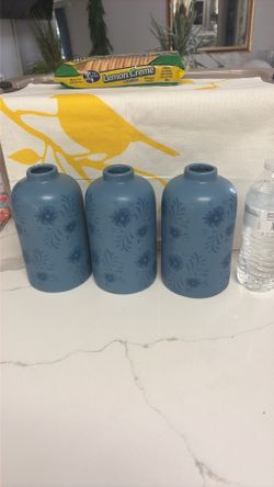 3 blue glass vases