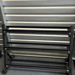 New rack for dumbbells holds 12 pairs. New in box $125