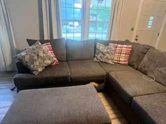 Two piece sectional plus ottoman with storage