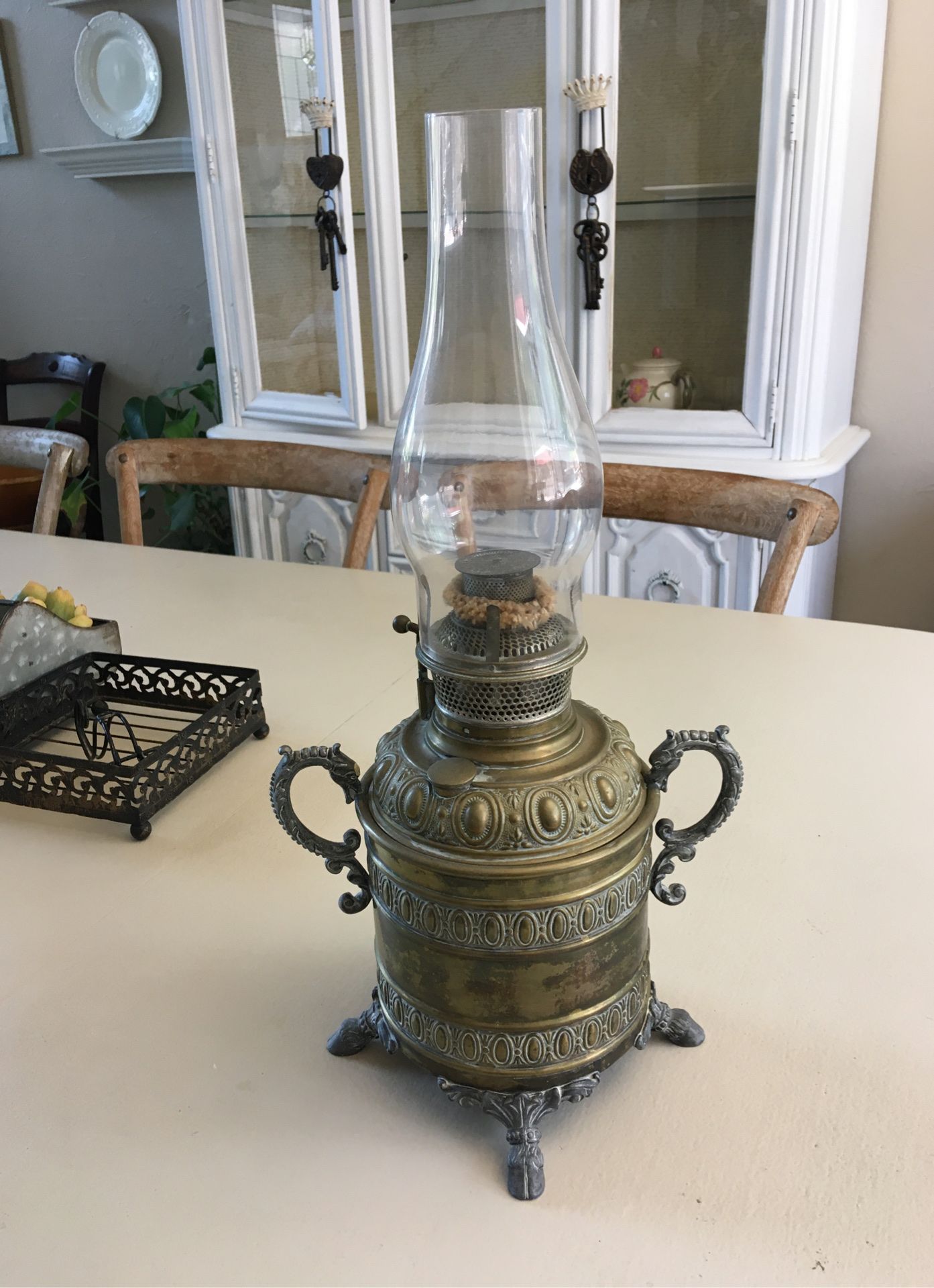 Beautiful brass antique oil lamp , very detailed and decorative there are two pieces to the lamp in inner casing and an outside casing