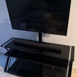 Samsung TV with stand, Soundbar, And Subwoofer 