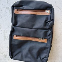 Cool brown and navy rolling suitcase
