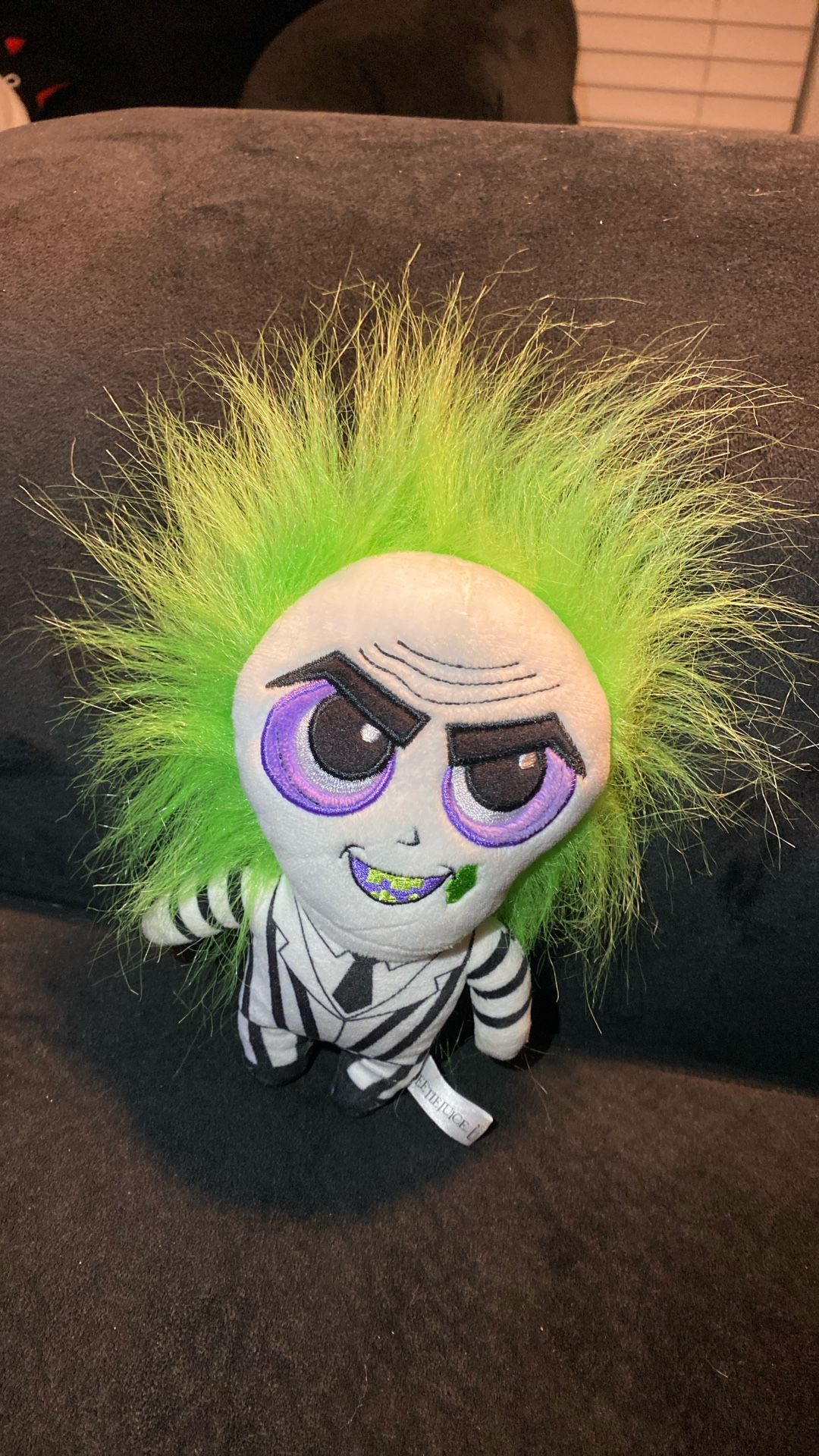 Beetlejuice plush excellent condition iconic character signature black and white striped suit, black boots, and wild green hair. The doll has a detai