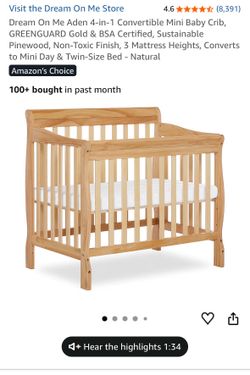 Brand new mini crib with mattress. Still inside the box sealed. Look at the photos.