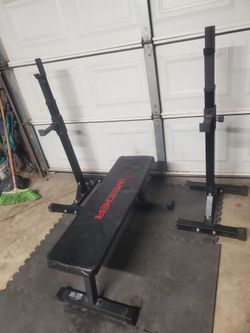 Flat Weight Bench With Adjustable Squat Rack With Spotters..used but still works good..