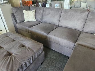 Brand new dark gray microfiber reversible sectional + ottoman (112"x85")