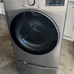 Graphite steel front load lg  dryer   with pedestal working perfectly extra for delivery same day delivery and installation available