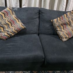 Two Sofas With Pillows and Lift Top Coffee Table