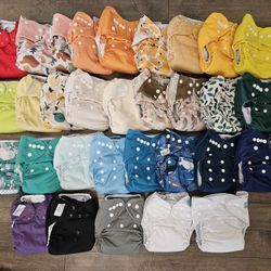 31 Cloth Pocket Diapers + Custom Zorb Inserts, Huge Lot + Wet Bags - BumGenius, Nora's Nursery, Alva
Baby