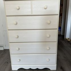 Tall cream/white colored dresser