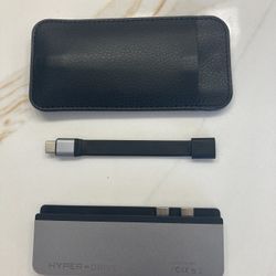 HYPER HyperDrive DUO 7-in-2 USB-C Hub in space gray is an accessory that expands the connectivity options for various Apple devices, including th