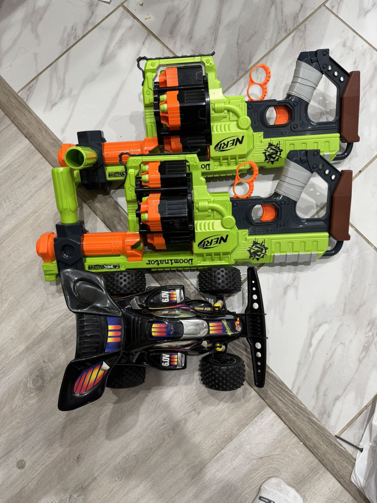 toy car and nerf gun