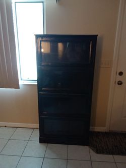 Tilt- out Media storage cabinet