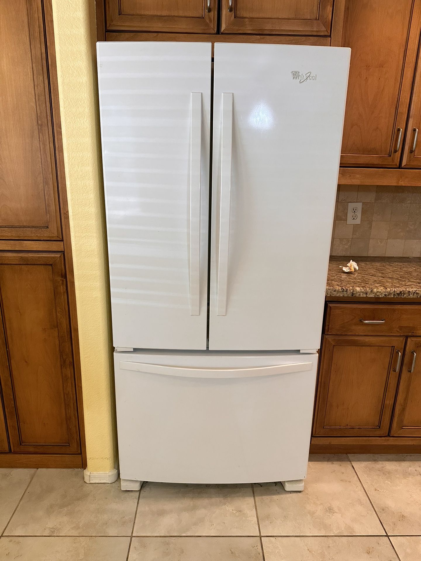 Kitchen appliances: Whirlpool refrigerator, Bosch dishwasher, Whirlpool stove, KitchenAid microwave.