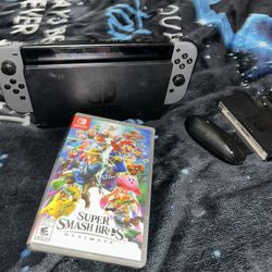 NINTENDO SWITCH WITH SMASH BROS AND JOYCONS