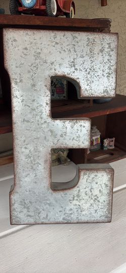 Large metal letter E