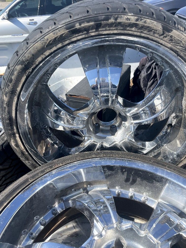 22 inch Ford F150 rims with tires and 1 new tire. $1100.00