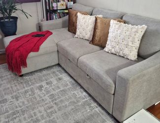 Couch with chaise storage roll out bed