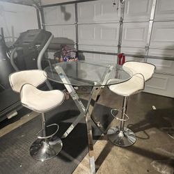 Craig-Luka Round Glass Top Metal Base Dining Table