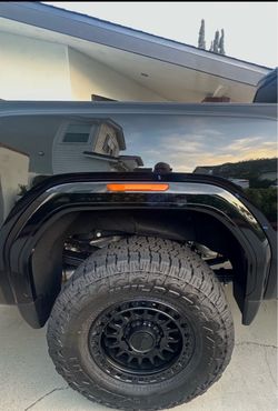 Like new 2026 GMC Sierra 2500HD wheels and tire