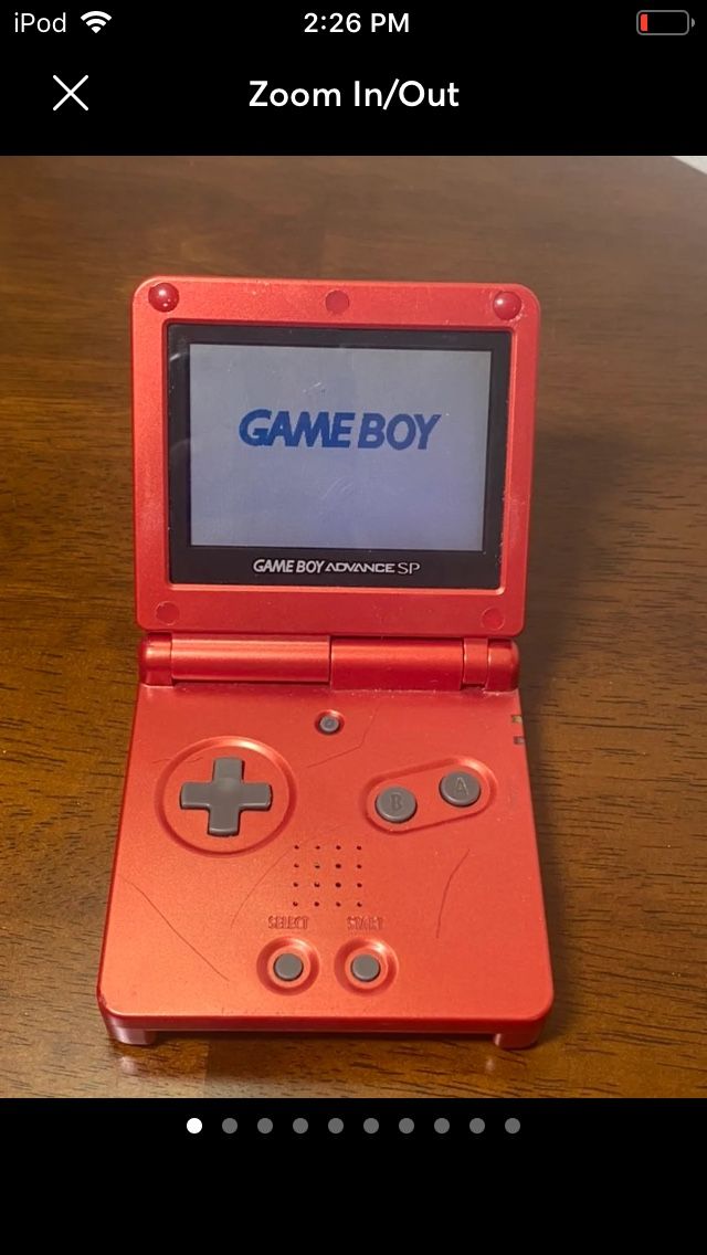 red gameboy sp with charger
